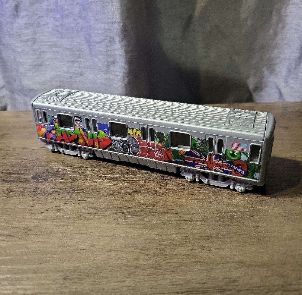 Graffiti Style Silver Toy Train